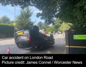 Picture of car on its roof on London Road